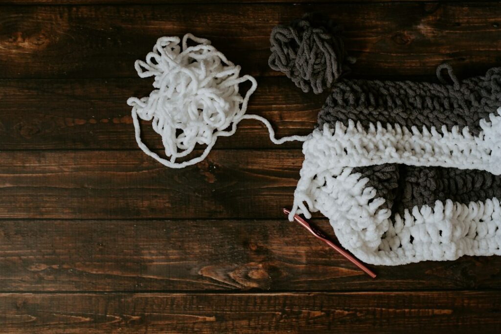 Thick chunky yarn being worked into a cozy scarf