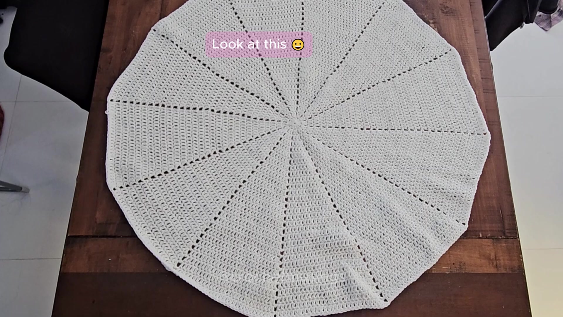 Round cream crochet blanket base with twelve radiating sections