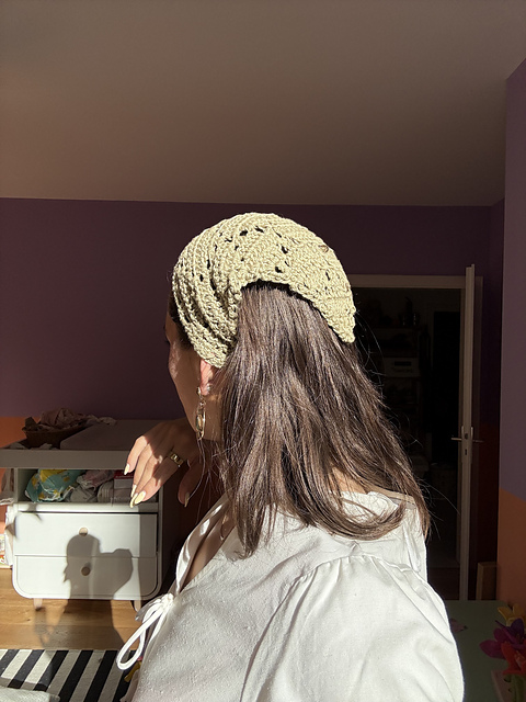 Finished cream crochet bandana worn indoors