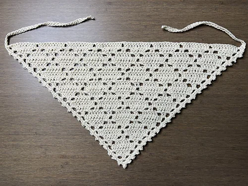Cream diamond lace crochet bandana laid flat with both ties visible