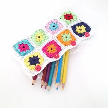 Flower granny-square pencil case holding colored pencils