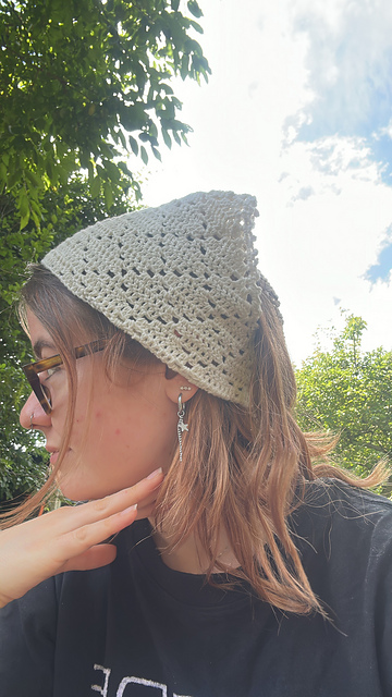 Cream lace crochet bandana worn outdoors