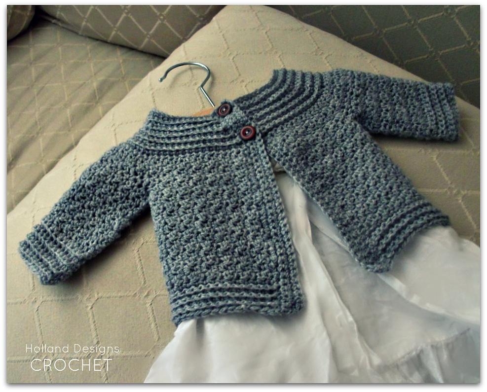 Blue-gray crochet baby cardigan with ribbing at the yoke, cuffs and hem