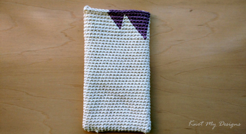 Cream crochet phone wristlet pouch with purple triangle colorwork by Knot My Designs