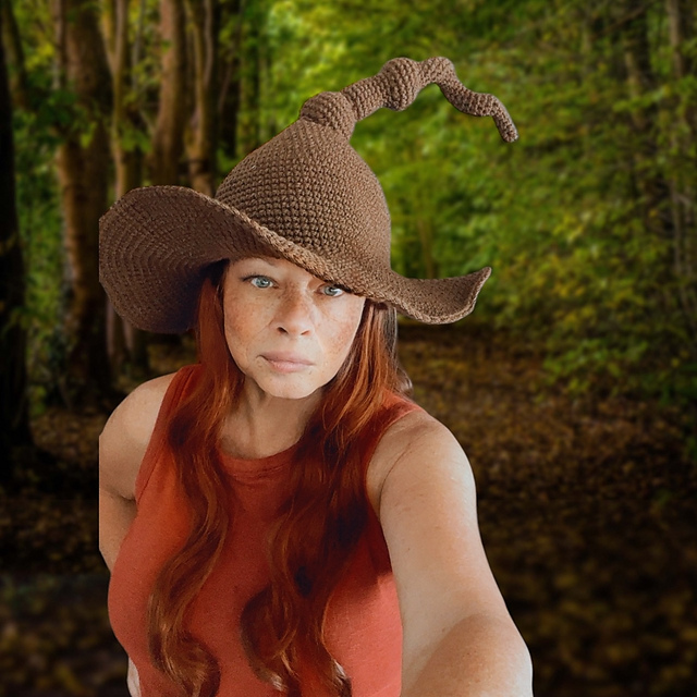 Brown crochet witch hat with a shaped brim and curved pointed crown