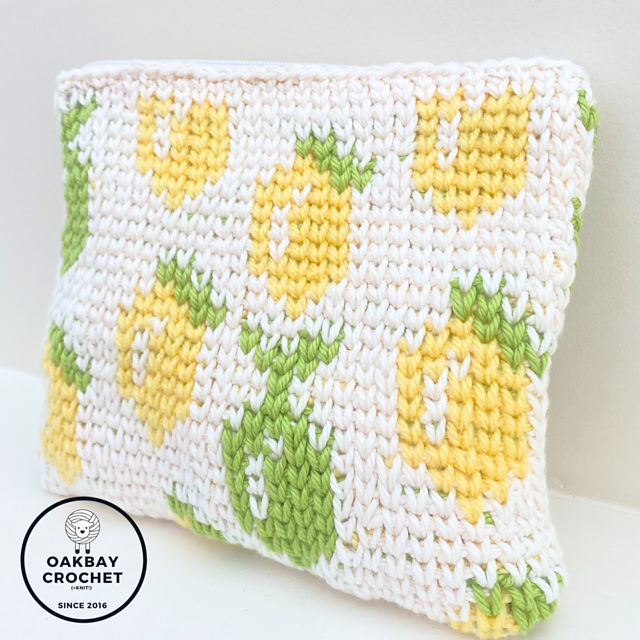 Crochet zipper pouches with yellow lemon and green lime motifs