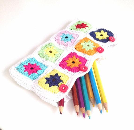 White crochet pencil case with colorful square motifs by Annemarie Benthem