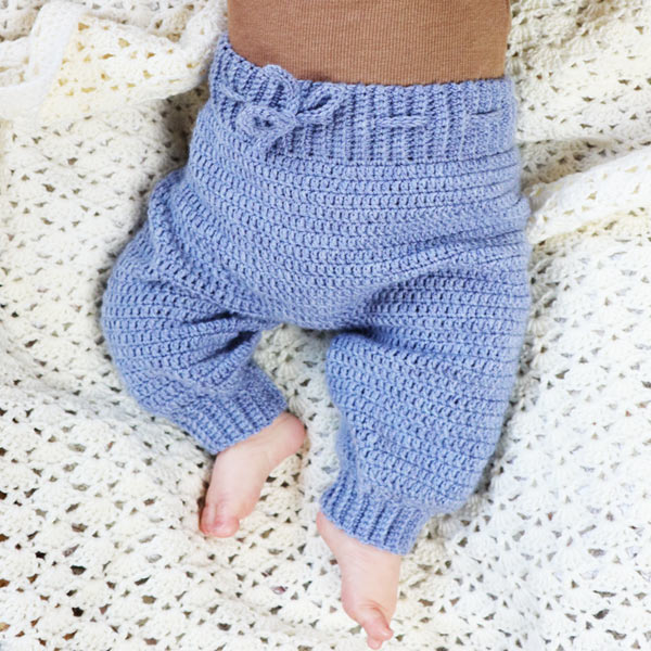 Pale blue crochet baby pants with ribbed waistband and ankle cuffs by Adore Crea