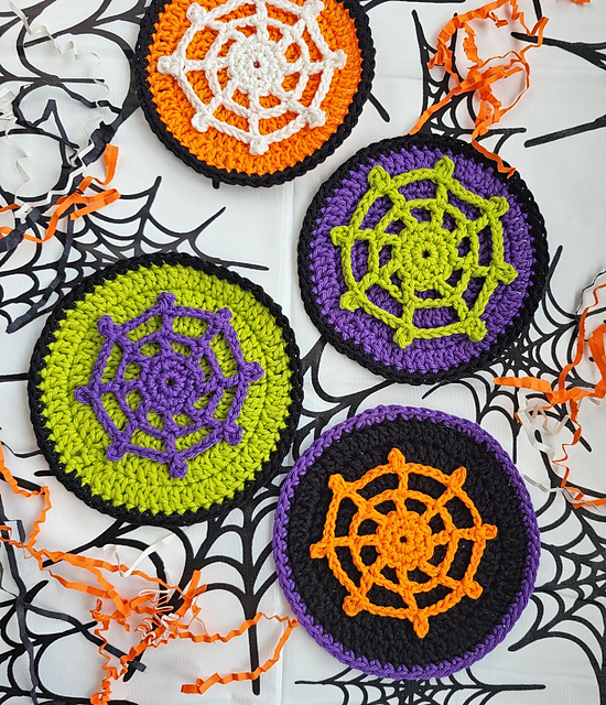 Orange purple and green crochet spiderweb coasters by Carmen Heffernan