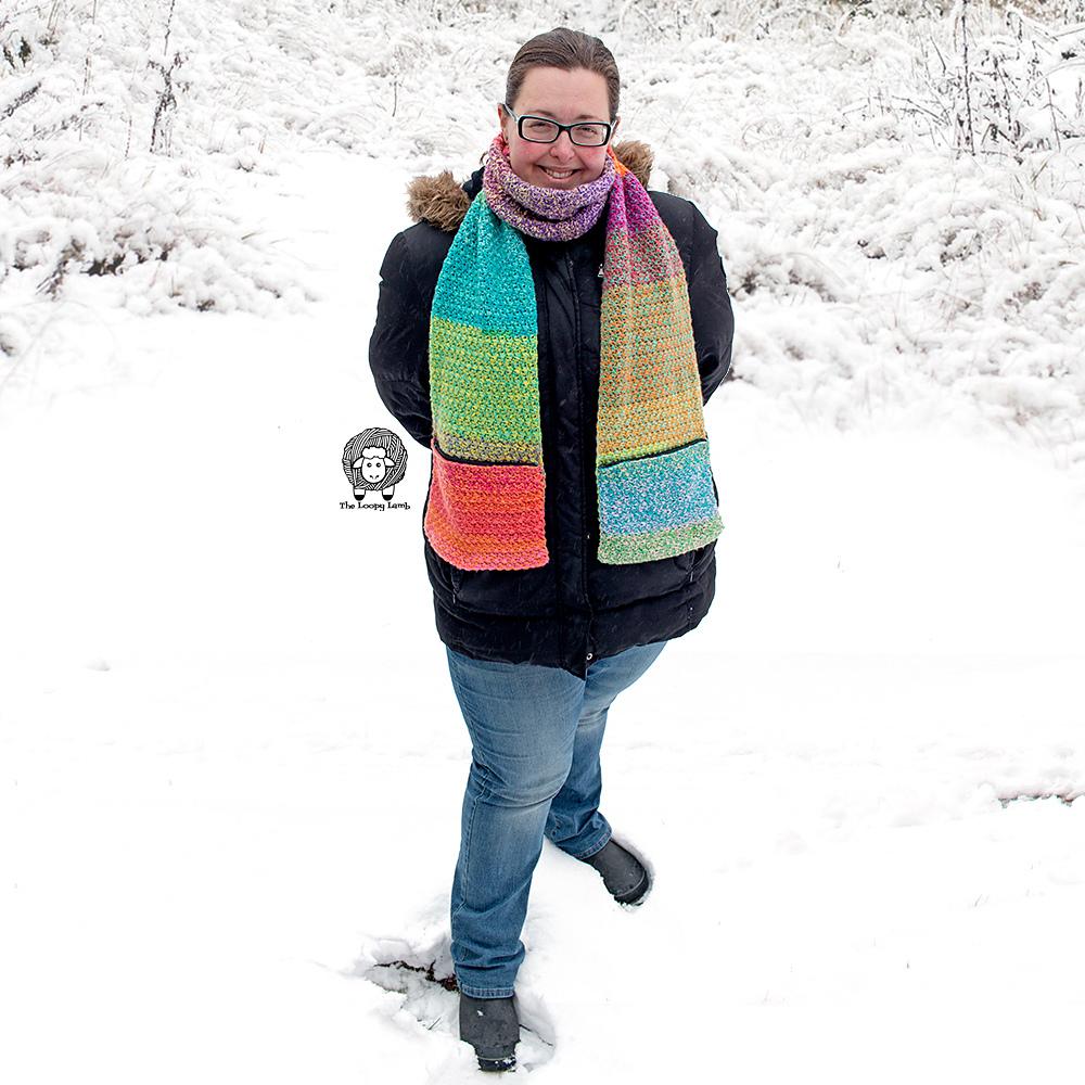 Colorful striped Tweedy Pocket Scarf worn outdoors by Ashley Parker