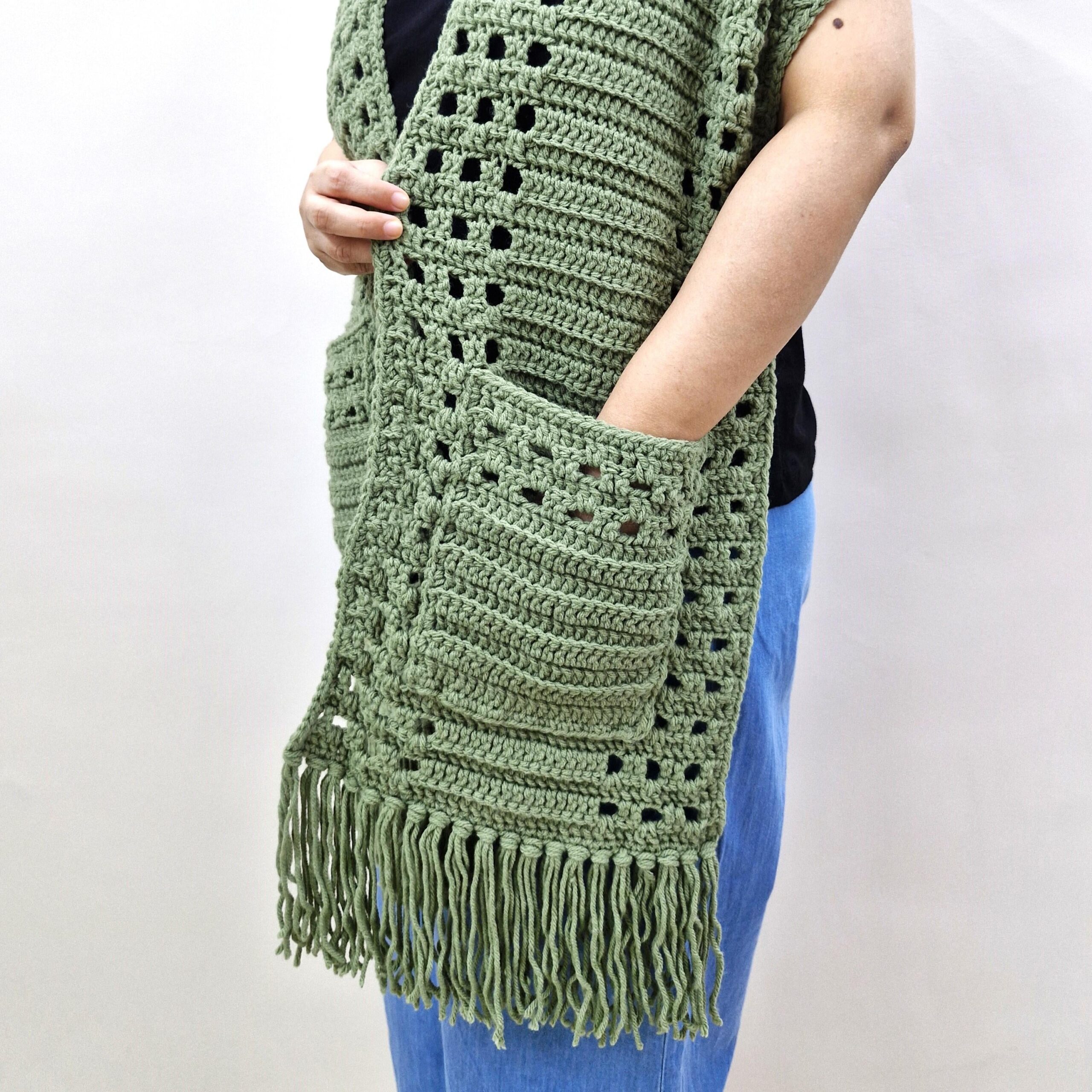 Close-up of the green Whispering Pines scarf showing its textured pocket and fringe