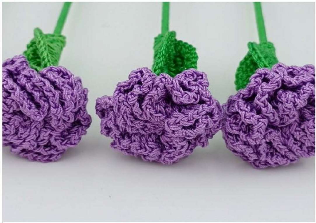 Purple crochet carnations with gathered ruffled heads