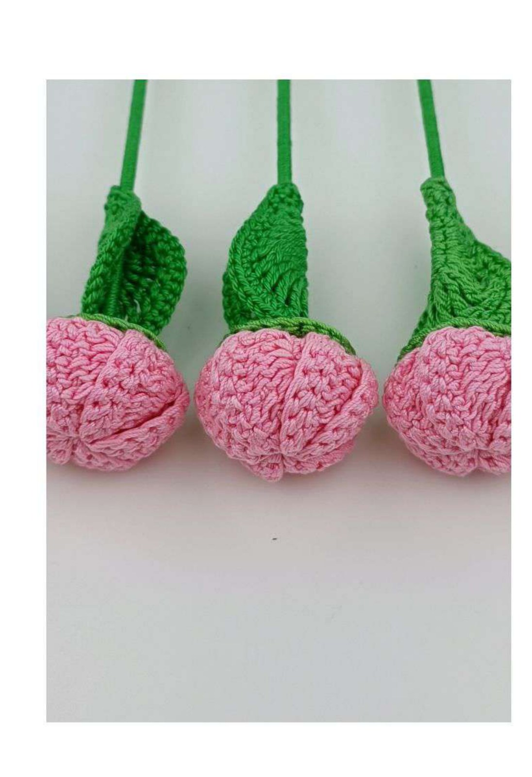 Pink gathered crochet buds on wrapped green stems