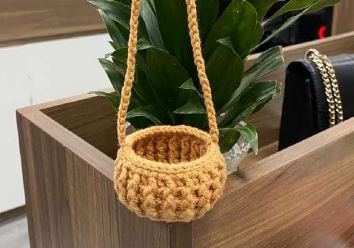 Textured crochet pot with its hanging loop