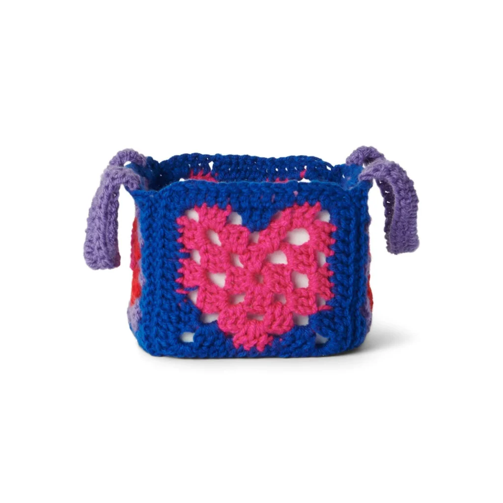 Crochet Granny Heart Basket Pattern with colorful yarn and heart design
