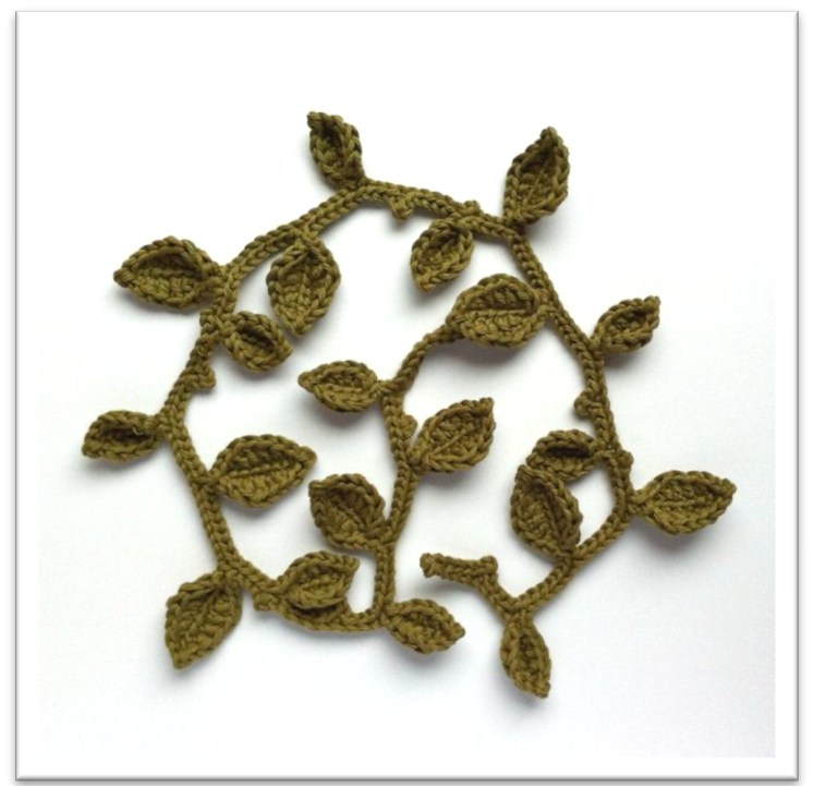 Crochet leaf garland with pointed green leaves along a continuous vine