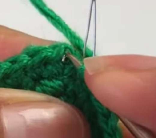 Thin wire worked along the edge of a green crochet lily leaf