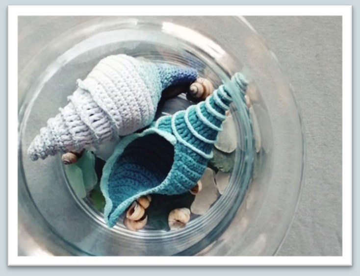 Crochet tulip seashell with a long tapered spiral and shaped opening