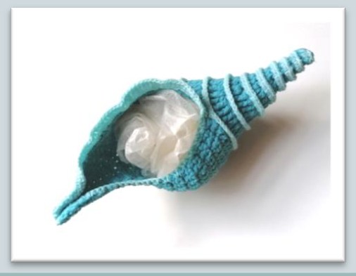 Crochet seashell supported during the shaping and drying stage