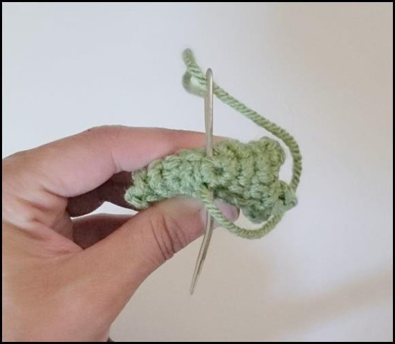 Sewing the folded back of a crochet Venus flytrap head