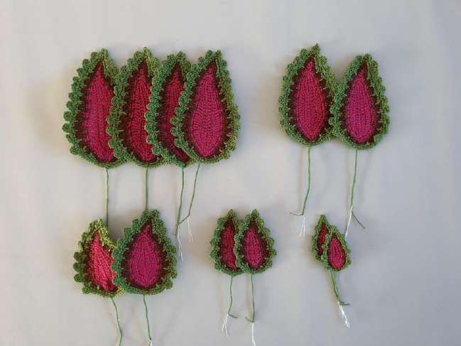 Five sizes of wired crochet coleus leaves before assembly