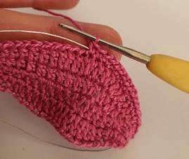 Wire being introduced around a crochet coleus leaf