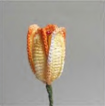 Yellow and orange crochet tulip with four cupped wired petals
