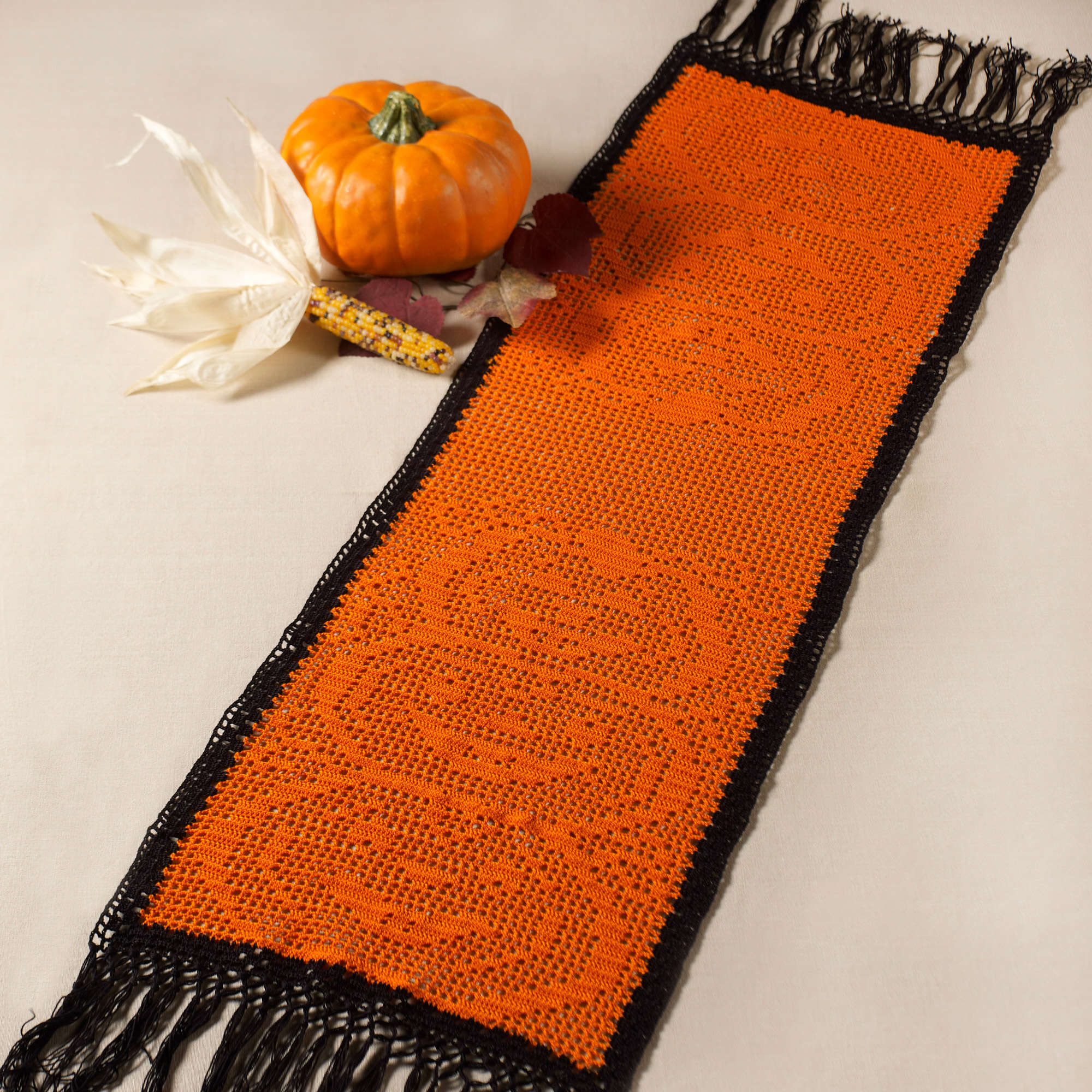 Stacked Pumpkin Table Runner crochet design by Aunt Lydia’s / Yarnspirations