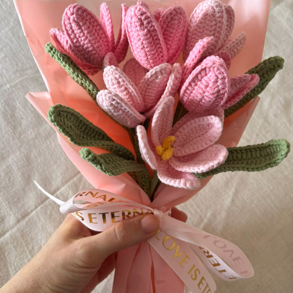 Pink crochet tulips and an open flower