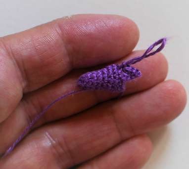 Purple crochet bluebell cup before the pointed edge