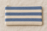 Illustration of a striped crochet pencil pouch with zipper