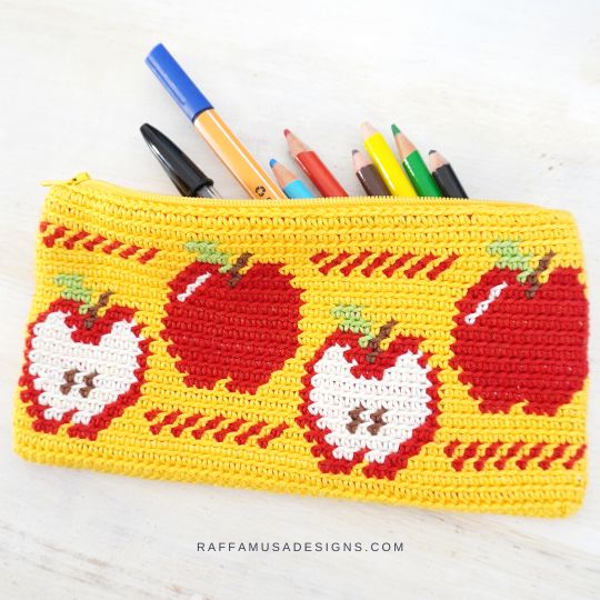 Yellow tapestry crochet pencil pouch with red apple motifs by RaffamusaDesigns