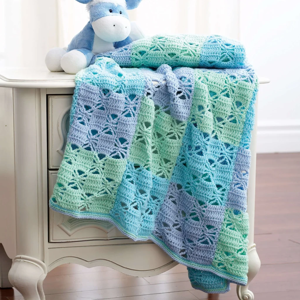 Three-color crochet blanket pattern showcasing vibrant designs and textures.